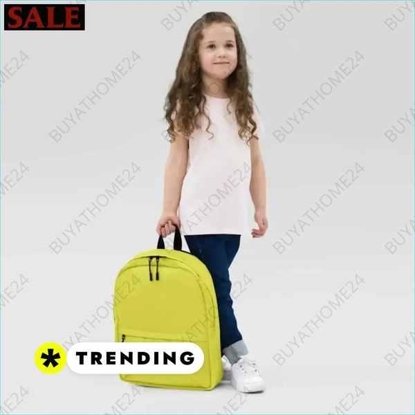 Kinder Schulrucksack von BUYATHOME24, wasserabweisend mit 15 Zoll Laptopfach, pinkes Design, getragen von einem Mädchen.