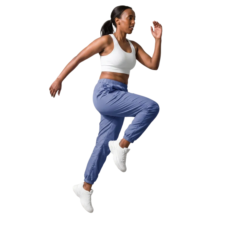 Hellblaue Unisex Trainingshose von BUYATHOME24 aus wasserabweisendem Polyester, verfügbar in XS bis 3XL, mit elastischem Bund.