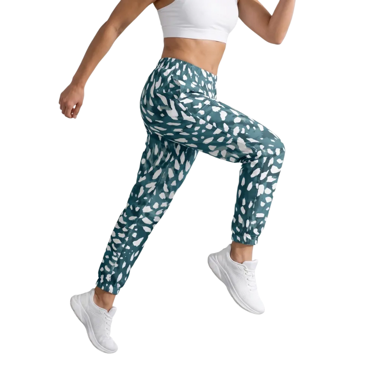 Unisex Trainingshose aus Polyester mit Reißverschlusstaschen, in XS-3XL, bequemes Sport- und Freizeitoutfit von BUYATHOME24